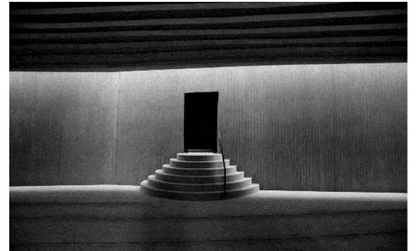 Likewise, the Sancaklar Mosque puts side the variety and reveals a design anguage that develops only within the cope of unity in terms of material selec- ion, form, and continuity, which is called olitary aesthetics (Eilouti, 2018). As Arolat nentioned, simplicity has been kept at the   Figure 6. Kible wall of the Sancaklar Mosque 