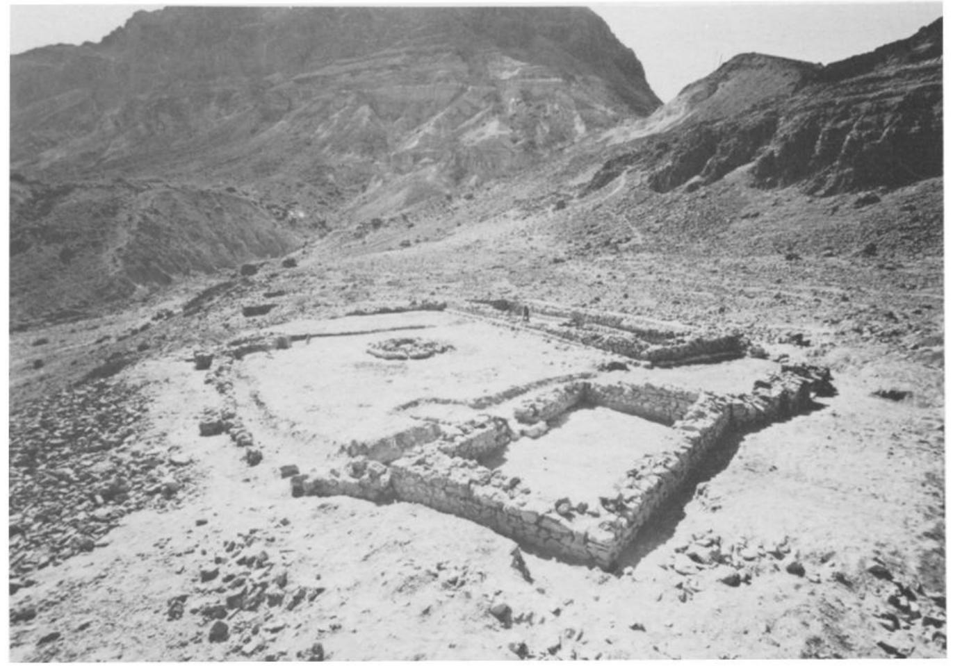 Fig. 13. General view of the temple; the lateral chamber is in the foreground.  It seems that the structures of the temple were adapted to the topo- graphy, since on three sides the walls reach the edges of the rock-terrace on which the edifice was constructed. The temple includes four separate structures (Figs. 12-13): the main gate-building, the secondary gate, the later- al chamber and the sanctuary. The four structures were connected to one an- other by a stone fence, thus forming an enclosure or courtyard. A circular installation was built in the center of the enclosure. The lower part of the walls of the structures was built of stones, fitted with care into the walls,  with clay and small stones filling the gaps. The upper parts of the struc-  