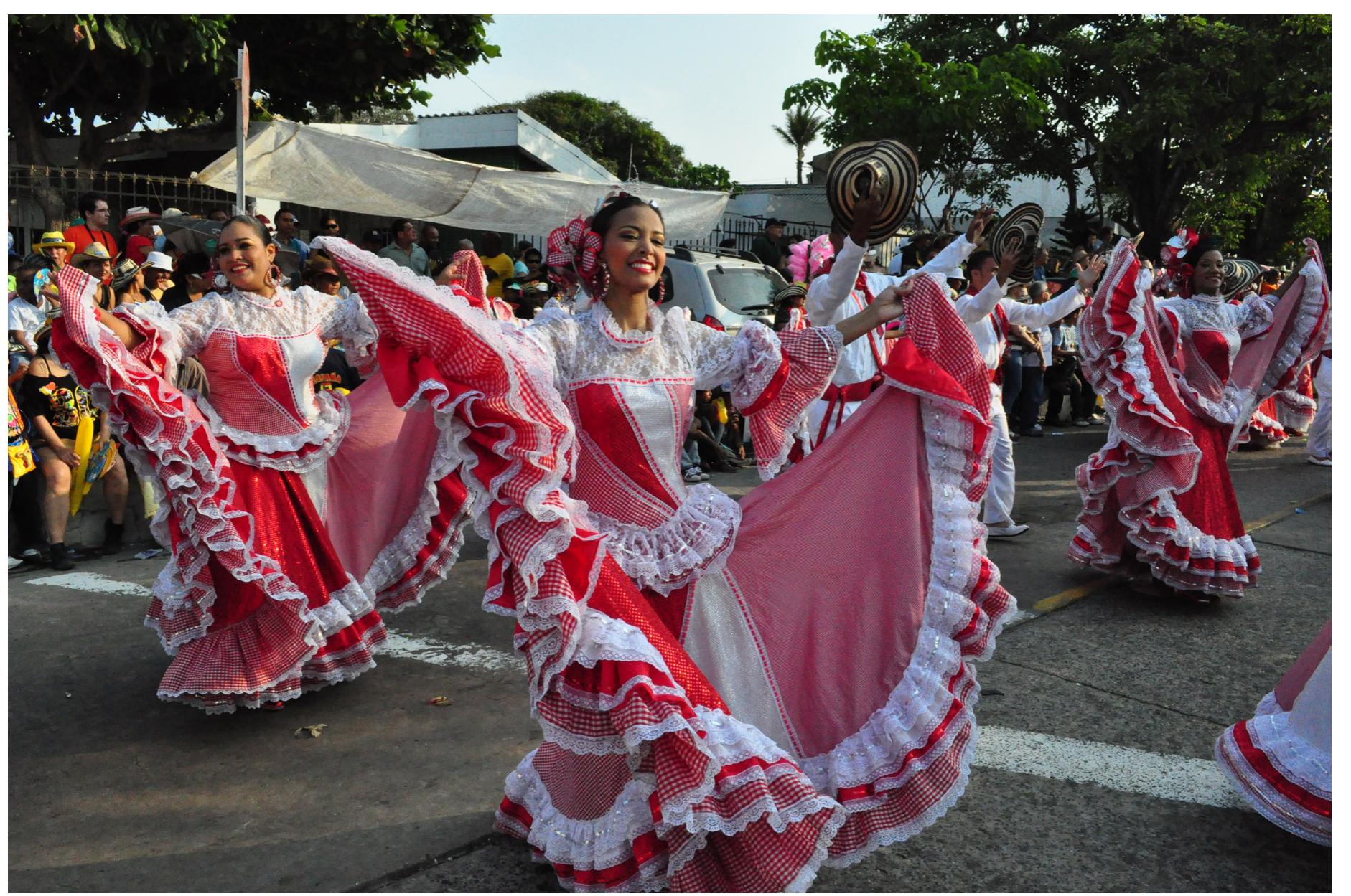 Dance group. the women wear the traditional “polleras”. the
