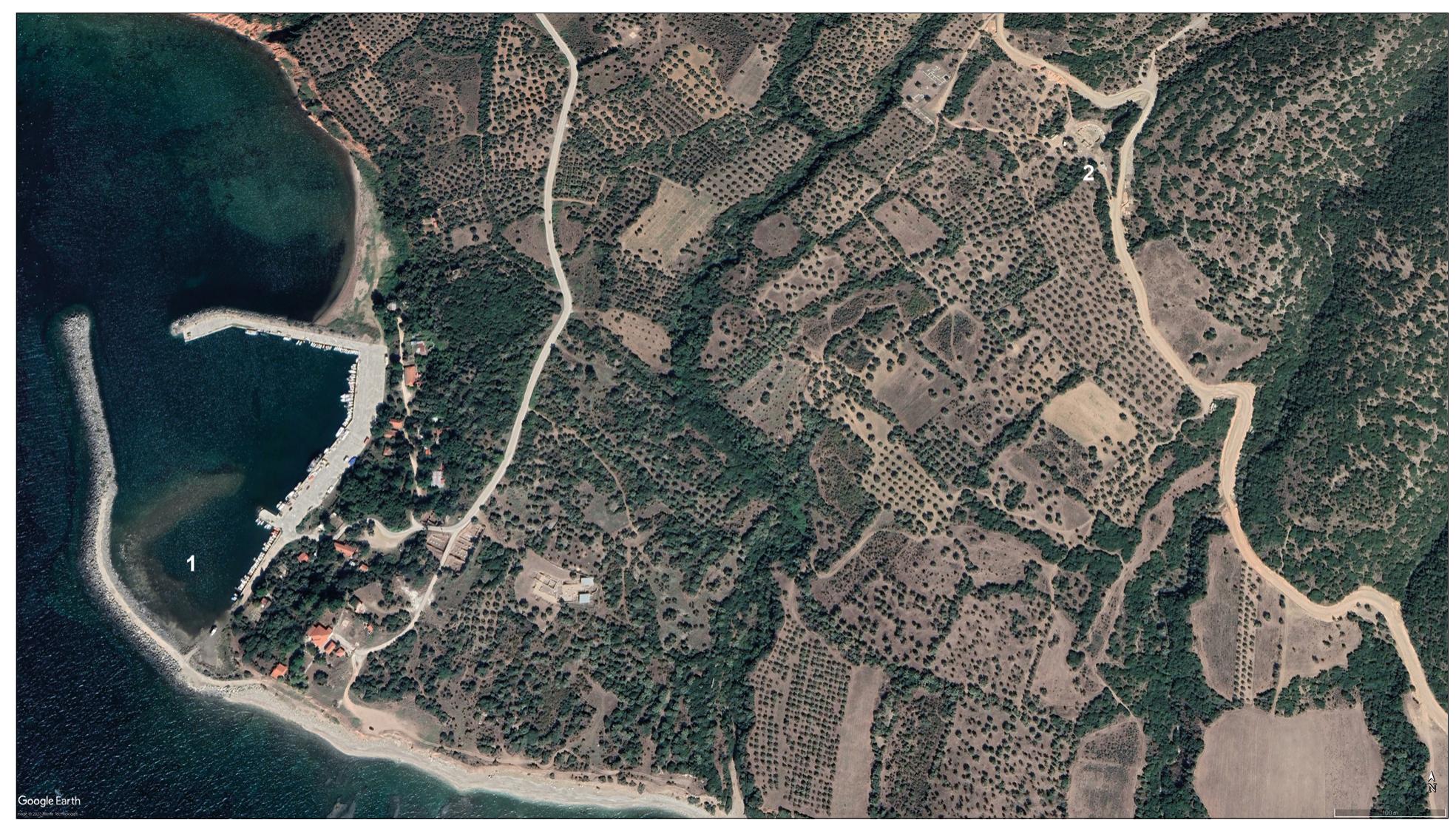 Fig.5 The area of ancient Maroneia extending from the harbour with submerged ancient structures (1) to the Hellenistic theatre (2). - (Satellite picture Google Earth). 