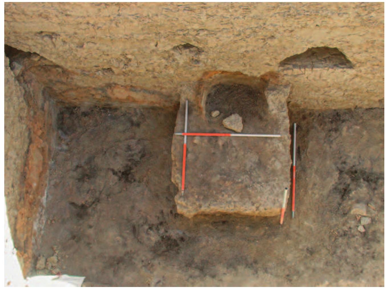 Fig. 27. View of the altar from the west, showing how the secondary fireplace was dug into the face of the east wall. 