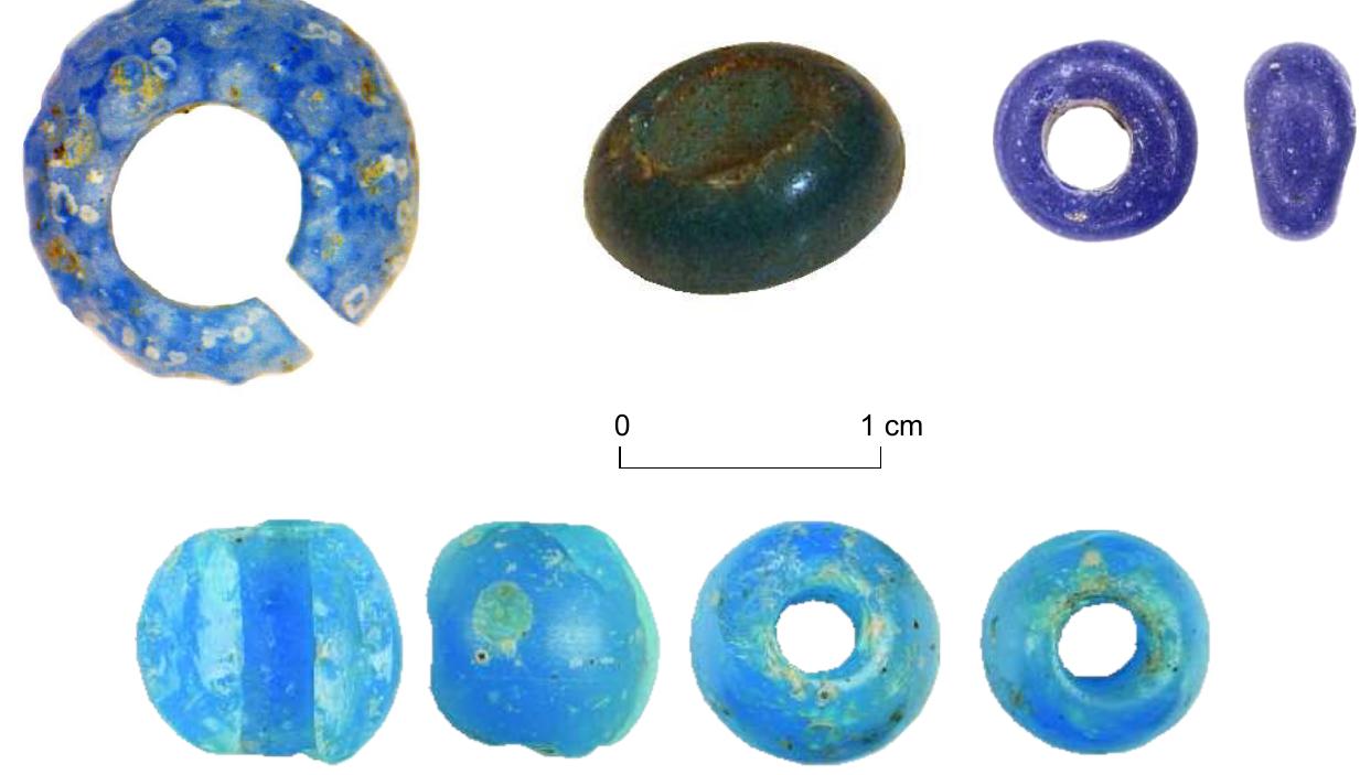 Figure 4. Upper register: Late Bronze Age small blue glass beads (Left: Very small (1.6 mm diam.) blue glass bead from grave B23 at Maastricht-Ambyerveld (from: Dyselinck 2013, 104 fig. 3.30). Middle: One of the two blue beads from a pit with LBA ceramics at Eefde (Verniers 2012, 85; Verrijckt 2014b, 19 fig. 25). Right: blue glass bead from Ooijen-Wanssum (Tolboom 2022b,  386 fig. 6.4.77)). Lower register: three globular light blue glass beads from Mariénberg (photo  © Wil van Bommel-van der Sluijs). 
