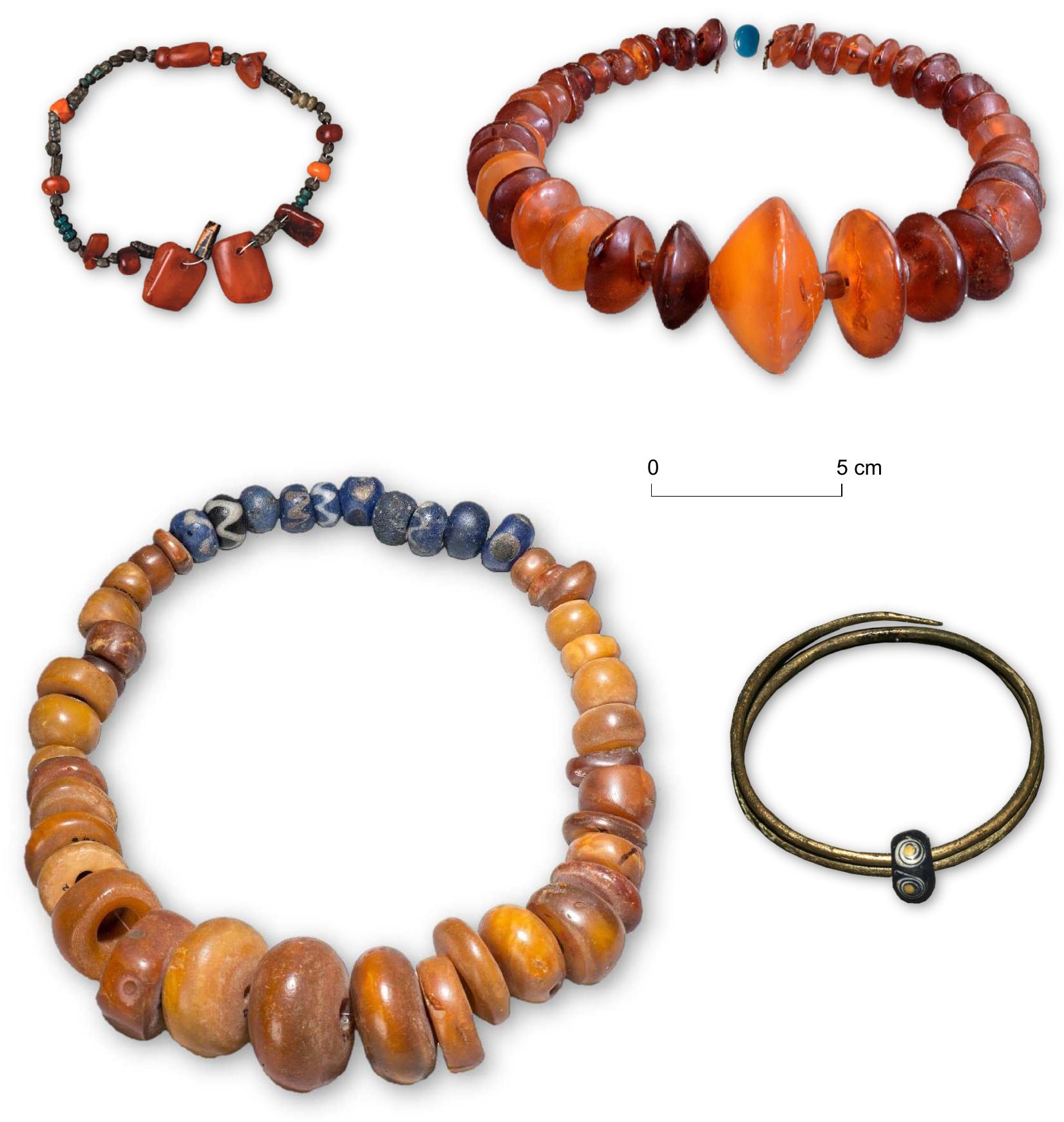 Figure 10. Long-term traditions of composite ornament deposits in wetland locations (top left: Exloérmond (MBA-A; Haverman & Sheridan 2006, photo © Drents Museum), top-right: Emmercompascuum  (MBA-A; Butler 1990, 65 fig. 10, photo © Drents Museum), lower left: Velsen-Noordzeekanaal (MIA; Van Heeringen 1992, 90(174), photo © RMO), lower right: Vriezenveen-Kooiplas (LIA, Van Beek 2015, 18, photo © Provinciaal depot bodemvondsten Overijssel). All to the same scale.  Landivisian tumulus (Piggott 1939, 193). It showcases that in the EBA vast networks existed in which exotic materials (cups of gold and amber, faience beads, spacer plate necklaces) travelled wide (Needham 2006, 77 fig.37; 2009; Sheridan & Shortland 2004) and the Netherlands did partake in these (cf. Haverman & Sheridan 2006). In this sense, the glass beads interred with the Ooijen-Wanssum grave and the two glass beads added to the Emmercompascuum ornament, indicate that necklaces with exotic materials were as much en vogue at the start of the MBA-B as in the preceding centuries (embodied by the Tiel bead and the Exloérmond necklace). Also, in types of depositional contexts, the  the Tiel bead and the Exloérmond necklace). Also, in types of depositional contexts, the 