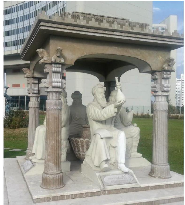 Figure 4: Al-Razi, aka Rhazes (middle) as part of the Scholars Pavilion or Scholars Chartagi. The monument is located outside the United Nations Office at Vienna, Austria. Credit: Yamaha5. CC BY-SA 3.0 https://creativecommons.org/licenses/by-sa/3.0, via Wikimedia Commons. Edited, original version available from: https://upload.wikimedia.org/wikipedia/commons/0/06/ Persian_Scholar_pavilion_in_Viena_UN_%28Rhazes1%29.jpg. 