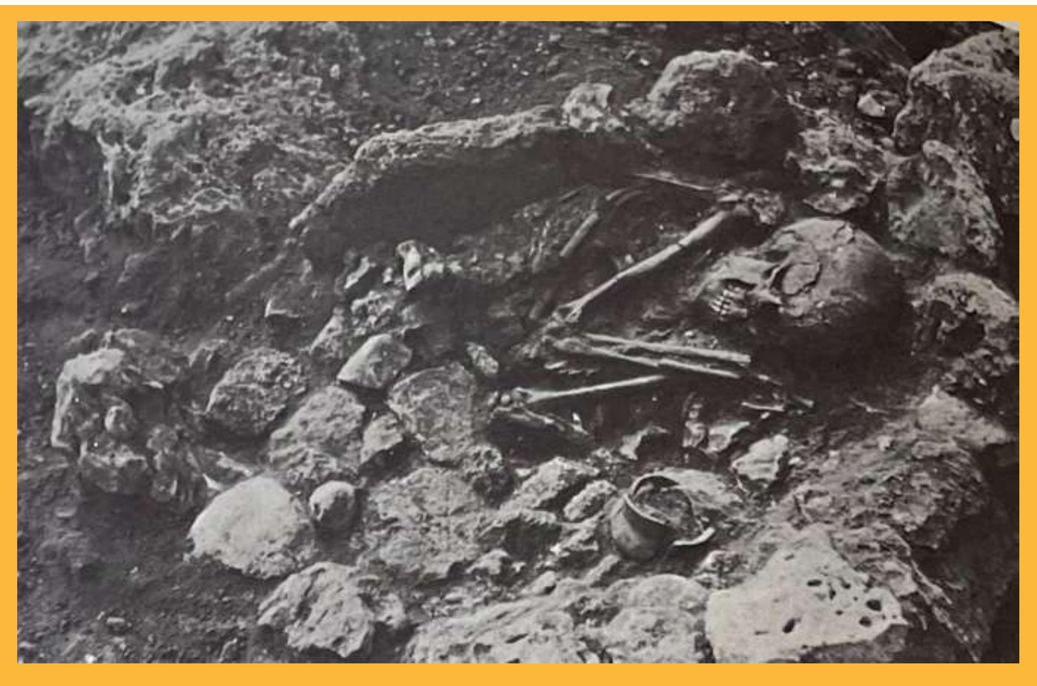 Figure 19:  Stone Cradle Burials (courtesy to Dunand, 1973: Pl. XXXVI - 1).  Then, a new burial practice was introduced, involving cradle or cist graves (Fig.19). The deceased were placed in semi-flexed or flexed positions within cradles constructed from upright stones. This suggests a more careful approach to the disposal of the deceased (Jidejian, 1968: 10). Stone cradle burials contained a pavement made of small stones, roughly the size of two fists, typically surrounded by a row of more or less spherical stones measuring around 15 to 20 cm in their largest dimension. The skeletons within these burials were positioned similarly to those in soil graves but were often accompanied by more elaborate grave goods, including ornaments and pottery vessels (Dunand, 1973: 30).  
