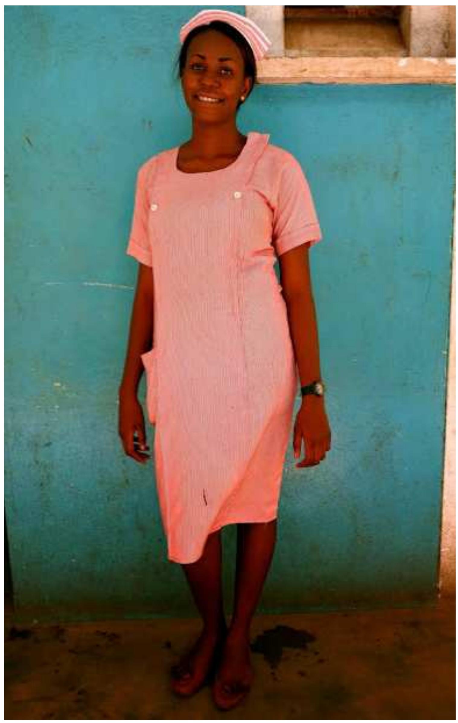 Figure 13 “State registered nursing students (which requires a higher entry qualification than the community nursing students) wear this pink uniform every day of class. Their year of study is identified by the stripes on their nursing hat." 