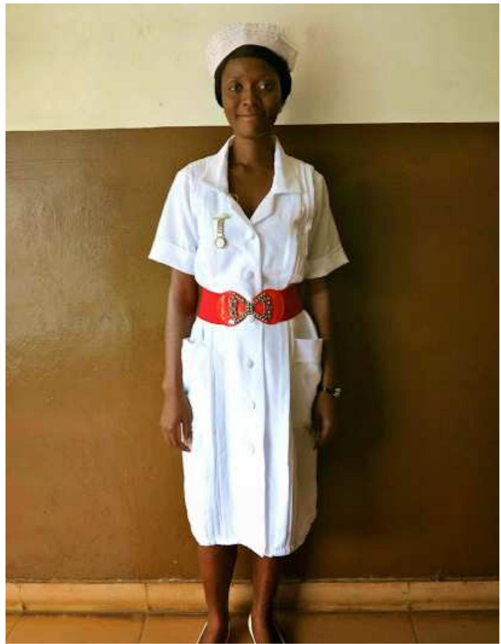 Figure 15 “Agatha is a fully qualified state registered nurse and required five 0 Levels to be accepted into the three year nursing course at COMAHS . State registered nurses wear all white uniforms with a red belt. There are no hard rules about the type of belt, I've noticed the elasticized variety with a jeweled clasp is quite popular. Agatha picked hers up from PZ market in town, Freetown's shopping epicenter.” 