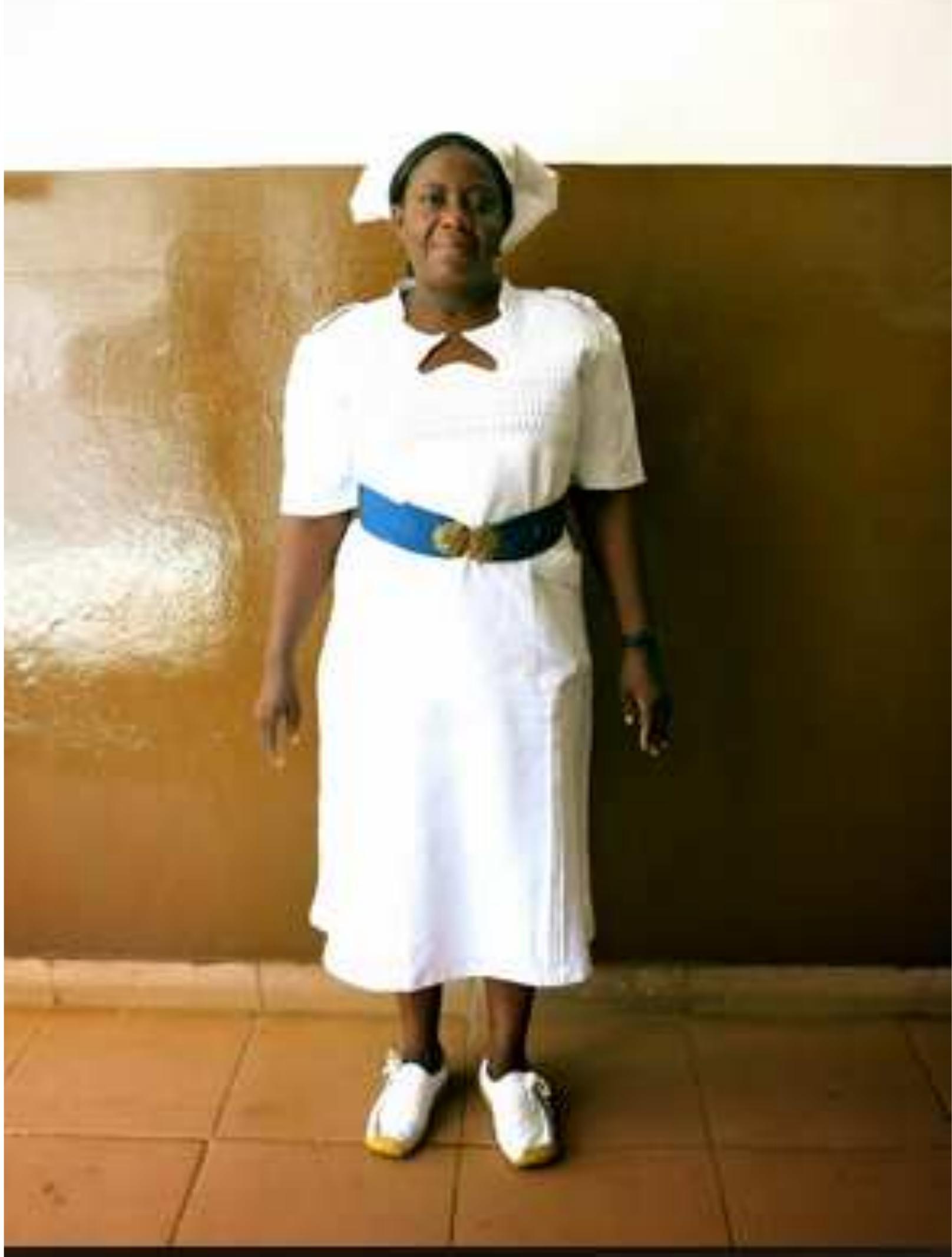 Figure 16 “The boss lady Matron Kamara is identified by her white hat and blue belt. The four stripes on her epaulette indicate that she is the most senior nurse in the hospital.” 
