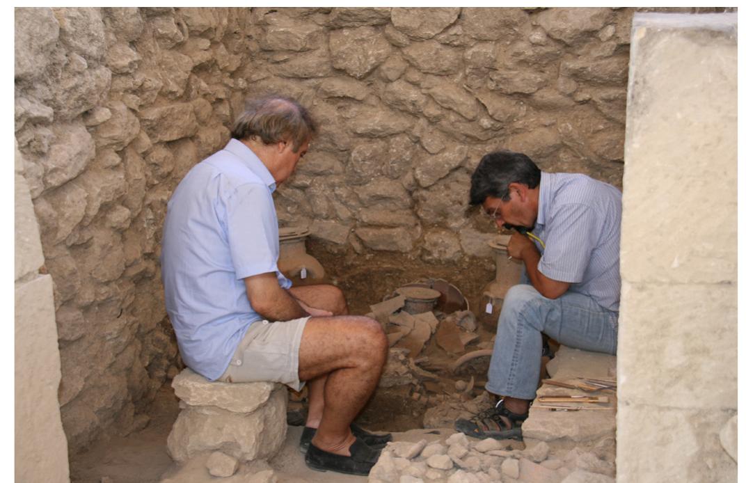 Etx. A. Nikos Stampolidis and Notis Agelarakis converging for an in situ assessment of a burial context relevant to one of the unique monumental funerary buildings of Orthi Petra (2009). 