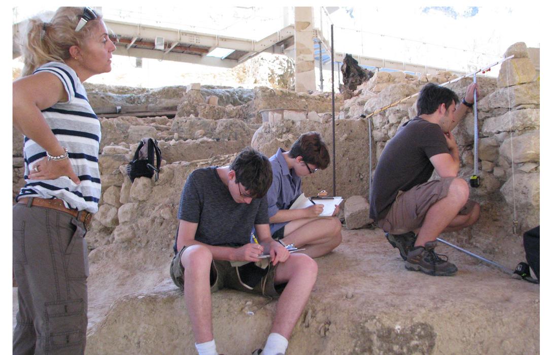 Ex. B. Argiro Agelarakis instructing our students in technical archaeological drawing at Orthi Petra (2013). 