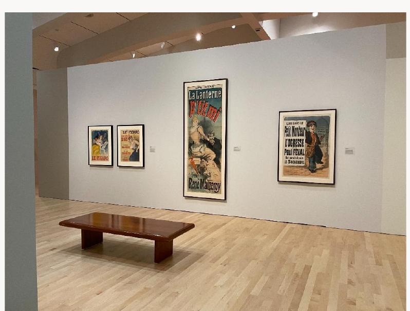 Fig. 5, Installation view of “The Latest Page Turner” gallery, left to right: Jules Chéret, Le Figaro (Le Figaro newspaper), 1904. Color lithograph; Jules Chéret, Le Figaro (Le Figaro newspaper), 1895. Color lithograph; Jules Chéret, Ptit mi par René Maizeroy, (a serialized novel by René Maizeroy published in  the newspaper La Lanterne), 1888. Color lithograph; Jules Chéret, L’Ogresse par Paul Féval (The Ogress by  Paul Féval, a serialized novel published in Le Petit Moniteur), 1874. Color lithograph. Milwaukee Art  Museum, Milwaukee. Artworks in the public domain; photograph by the author. [larger image] 