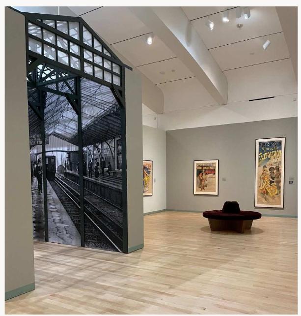 Fig. 7, Installation view of “Voyage” gallery, from  eft to right: Jules Chéret, Exposition Untverselle 1889:  Grand Concert Russe (poster advertising concerts performed by a Russian chorus at the Palais du  Trocadéro during the 1889 World’s Fair), 1889. Co  or lithograph; Jules Chéret, Musée Grévin, Souvenir de  l'Exposition (poster for the Musée Grévin that advertises a display of wax figures replicating the  Javanese dancers at the 1889 World’s Fair held  in Paris), 1890. Color lithograph. Milwaukee Art  Museum, Milwaukee. Artworks in the public d  omain; photograph by the author. [larger image] 