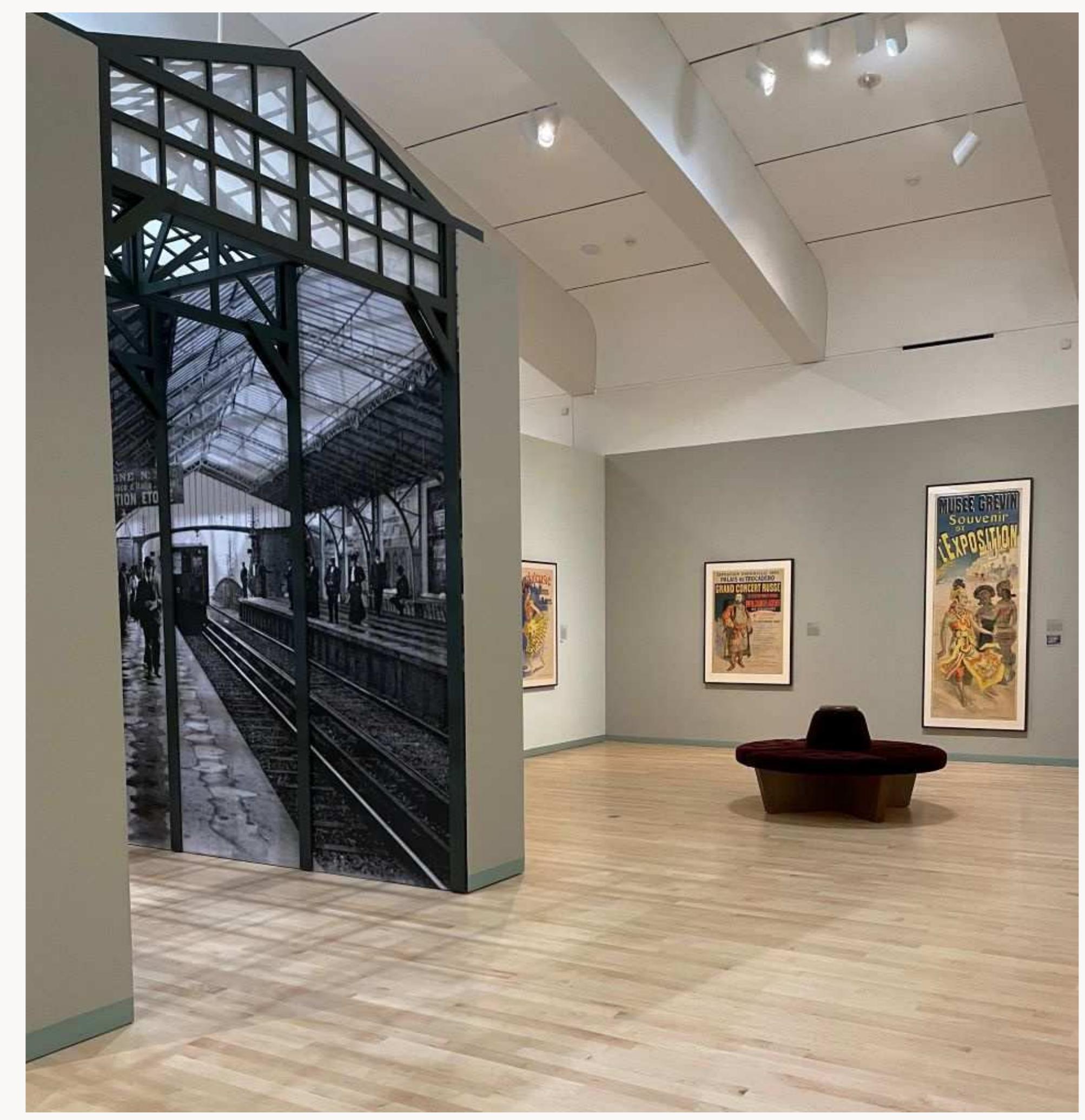 Fig. 7, Installation view of “Voyage” gallery, from left to right: Jules Chéret, Exposition Universelle 1889: Grand Concert Russe (poster advertising concerts performed by a Russian chorus at the Palais du Trocadéro during the 1889 World’s Fair), 1889. Color lithograph; Jules Chéret, Musée Grévin, Souvenir de l'’Exposition (poster for the Musée Grévin that advertises a display of wax figures replicating the Javanese dancers at the 1889 World’s Fair held in Paris), 1890. Color lithograph. Milwaukee Art Museum, Milwaukee. Artworks in the public domain; photograph by the author. [return to text] 