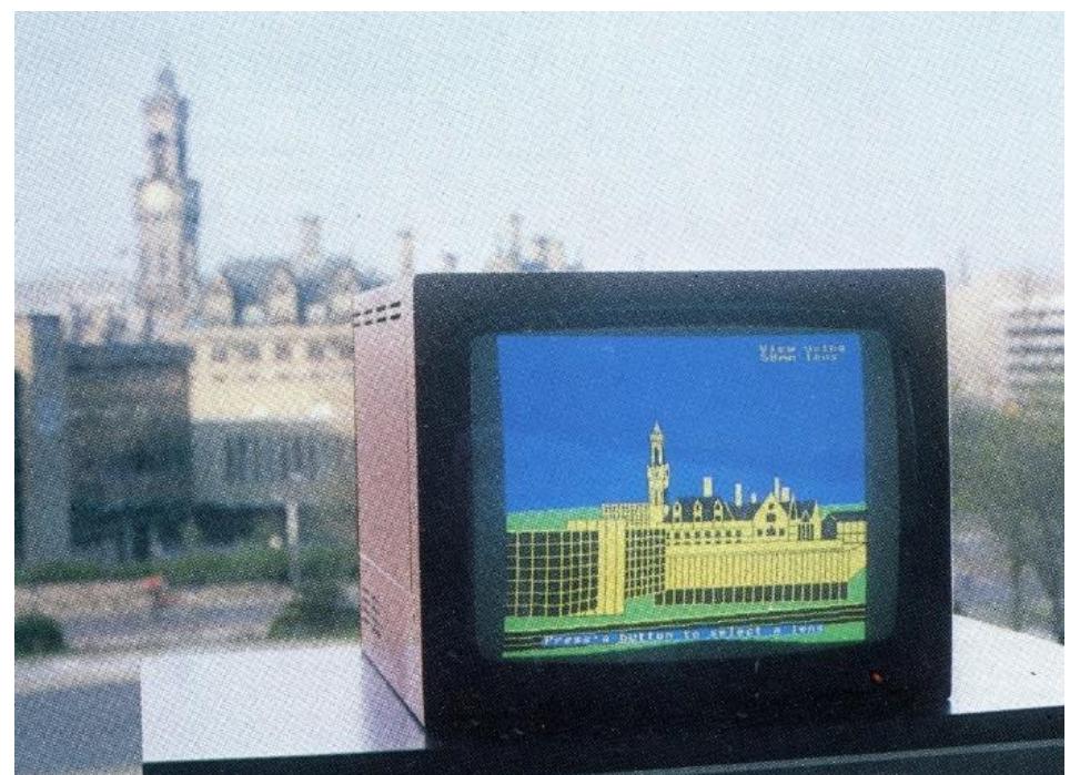 3. THE 1990S  Figure 4: Demonstration of different focal lengths of lenses on a BBC Micro personal computer at the National Museum of Photography, Film and Television, Bradford, UK (NMPFT 1983, p. 7).  In 1984, | produced a colour demonstration showing different focal lengths of lenses, using BBC BASIC on a BBC Micro personal computer for the National Museum of Photography, Film and Television in Bradford, UK (see Figure 4). The exhibit was located with a panoramic view of Bradford from the museum and a computer-generated version of the view, and the associated camera lens, using a lens with a focal length selected by the visitor. 