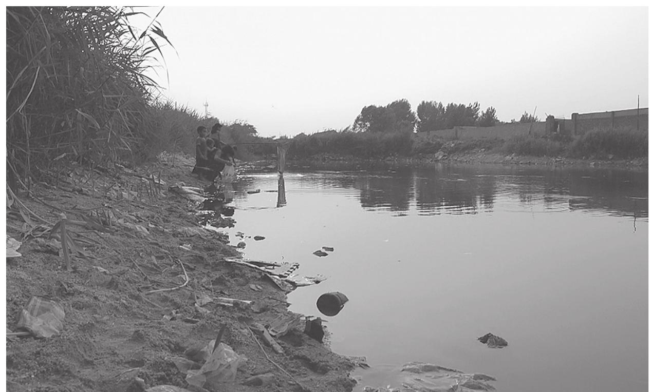 Figure 7.2. The children fish at the local river. Screenshot from Plastic China (Wang 2016). 