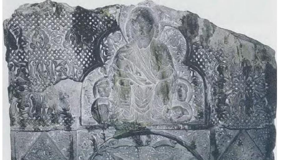 What is surprising when observing the faces of these figures is their physiognomy, which displays anthropological features typical of the Mongol people. For instance, the face of the enthroned Christ surrounded by the Tetramorph (fig. 3), carved at the apex of the khachkar commissioned by Hovhannes Orbel and dated 1304, is a significant example of the cultural interactions and visual exchanges occurring on Armenian territory during the  years of Mongol rule (1230-1335).  Fig. 3. Christ enthroned with Tetramorph, Khackar, 304.  This cohahitation forced many of the Orhelian familv 
