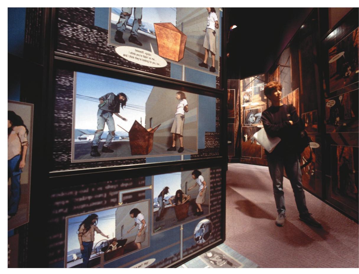 Figure 2. Walk-In Comix is a graphic novel that tells the story of five teenagers who lit- erally get lost in a world of text and can only find their way out by learning to read it. The exhibit’s mazelike structure, which reflects the story’s twists and turns, actually envelops the reader.