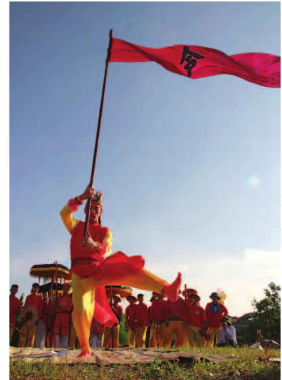 The commander of the flag waves the flag to symbolize the