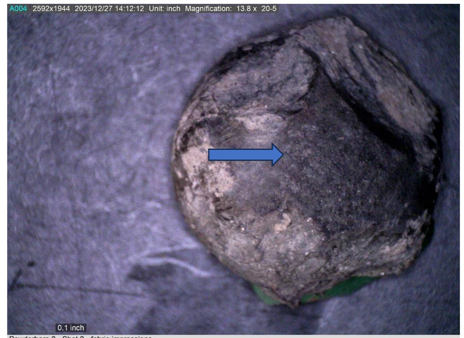 Figure 46. Photomicrograph of the split ball surface showing fabric weave impressions from passing through the cloth. 