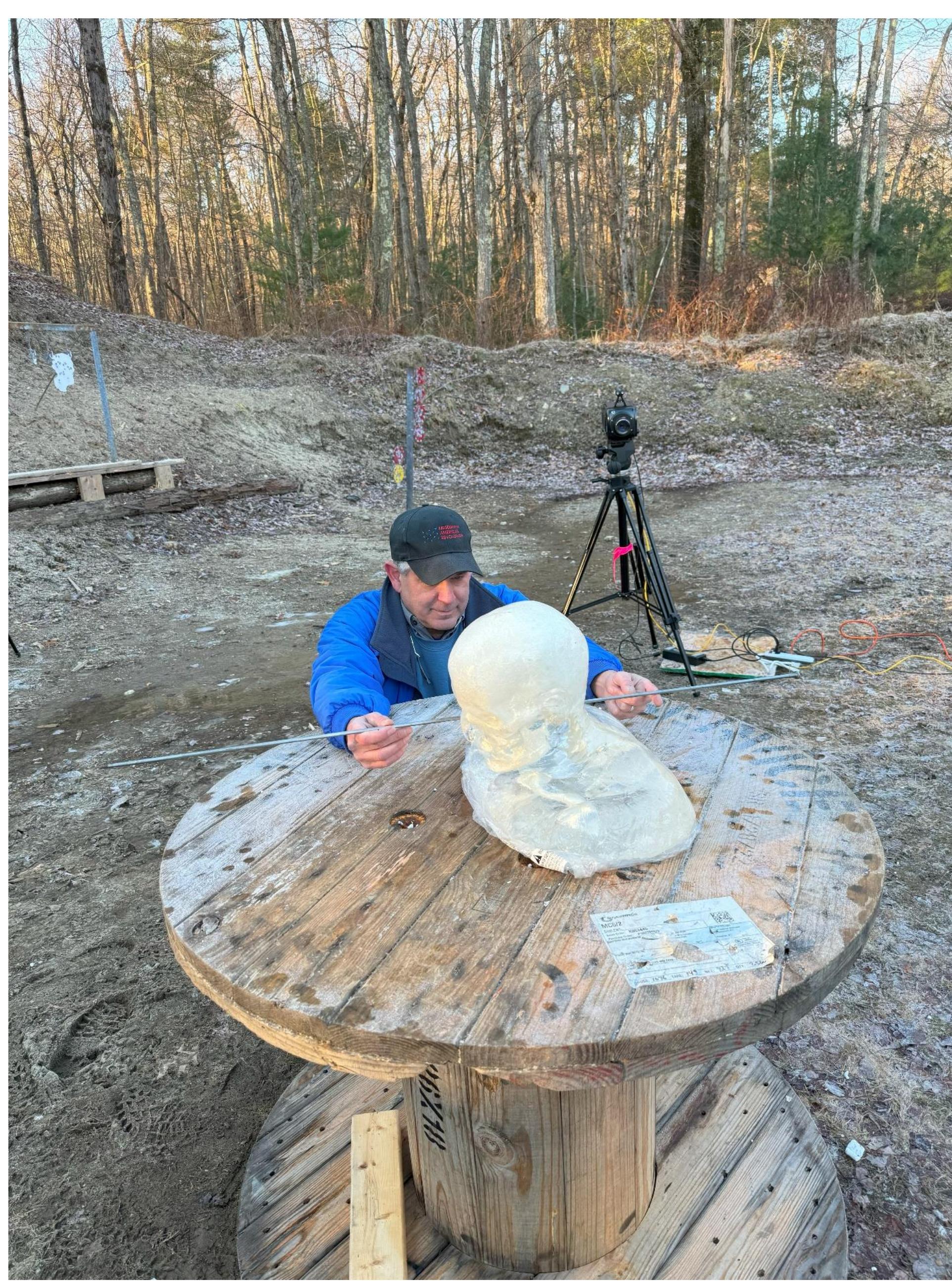Figure 49. Joel Bohy positioning the bust and aligning the shot angle for the shooter. 
