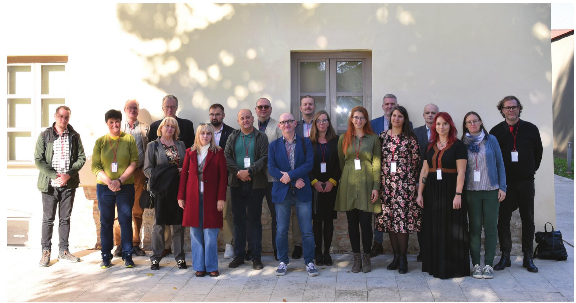 Figure 1. The participants in front of the Museikon, which hosted the conference (photo Rares Diodiu, MNUAI)  Poll “  One objective of this project was to foster the regional scientific debates on this topic by provid- ing a platform for the researchers focusing on the landscape archaeology of the Carpathian Basin in the Iron Age and Roman provincial period. That is why an international conference was organized at Alba Iulia (Romania) on 20-22 October 2022, with the title The Archaeology of Communities and Landscapes in the Carpathian Basin. Interdisciplinary Perspectives. The conference was a real suc-  cess, with a total number of 33 participants presenting 24 papers, each generating lively discussions and exchanges of ideas. 