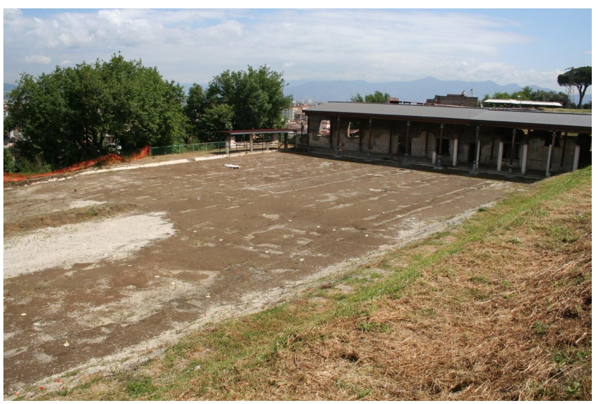 Fig. 2 — View of the Great Peristyle showing soil contours defining ambulationes; disturbed area at left is a landslide. (Author; Courtesy RAS).  Giovanna Bonifacio, the archaeological contractor Caccamo (Salerno), site supervisor was assistant archaeologist/geometra Enzo Sabini of the SANP and RAS, who had worked with Wilhelmina Jashemski on some her garden projects. He recognized many of the details of the garden surface and his crew manually cleared the last 2 meter with care. By November of 2007, one of the largest formal gardens yet revealed in the Bay of Naples was fully exposed. At this time, the Restoring Ancient Stabiae Foundation was asked to prepare a record of the garden features. They arranged for Ground Penetrating Radar, LIDAR surveys, as well as conventional surveys and field plans to be quickly made. Geom. Sabini provided recommendations on the materials and methods on the clearing and casting of the cavities. 