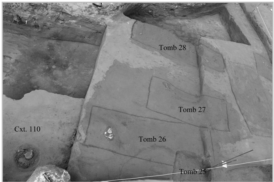 Fig. 25- General view of Context 110 containing the skyphos and Burials 25, 26, 27 and 28. 