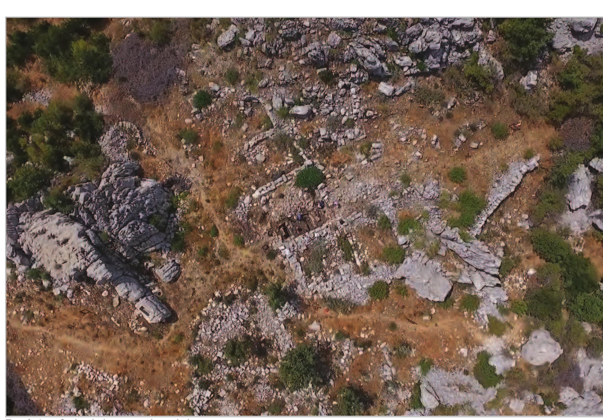 Figs 6- Area 2, sketch drawing and aerial photo.  Area 2/2  identification of this vessel could be a Middle Bronze Age cult stand, as we know them for example from Kamed el-Loz’. It is not clear yet whether it is indeed one vessel, or possibly several. When the pottery from the adjoining Area 2/1 was washed, it appeared that more pieces of the same or similar vessels were also found in that square among the Middle Bronze Age pottery from that context. Due to the two parts set within each other it is possible that the “tannour” in Area 2/2 was not in its original location, although its preservation and upright position make it at least possible that it was in situ.   Report on the 2017 archaeological soundings at Qornet ed-Deir, Jabal Moussa Biosphere Reserve  The sounding in the middle of the room, called 2/2, revealed under the stone collapse on the third day  of excavation the outline of a  round pottery structure  adjacent to the southern wall of the room, which was  first interpreted as a tannour,  context 2009 (Fig. 9).  As the walls of the “tannour” made of fired pottery (or  even made of reused pithoi)  they were consecutively collected and bagged  separately. It became apparen  outer and inner wall (Fig. 10), or indeed two layers  of pottery set one into the ot  ooked to be restorable, that there was a distinc  her. When the material  was washed, it was found tha  and possibly three rim forms, and there was evidence of fenestration or at least one opening with vertica  there were at least two  finished edges perpendicular to the rim®. Although the structure could be used as a tannour, another possible 