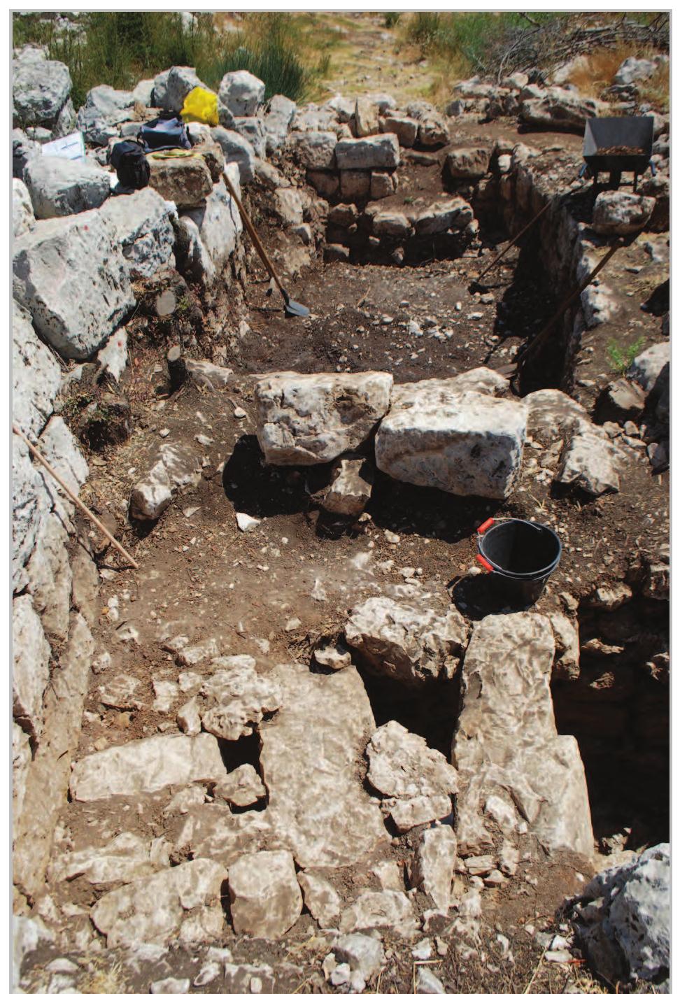 Figs 12- Area 2/3: view of the stone slabs covering the entrance to the chamber from the west.  Fig. 11- Area 2/2: detail of “tannour” seen from the east. 