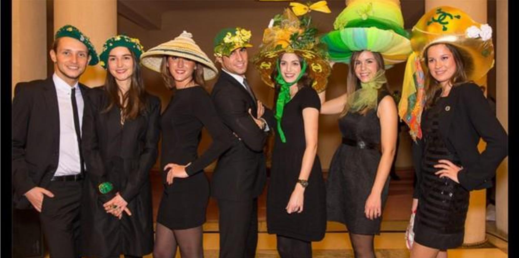 Figure 4: Green and Yellow hats of the défilé winners at the Theatre Champs Elysées, Paris 2013 QWikipedia Commons  many future husbands. Thus, the custom always balanced between the traditional idea of marriage “in time” and also as a sign for the identification of the woman worker. 