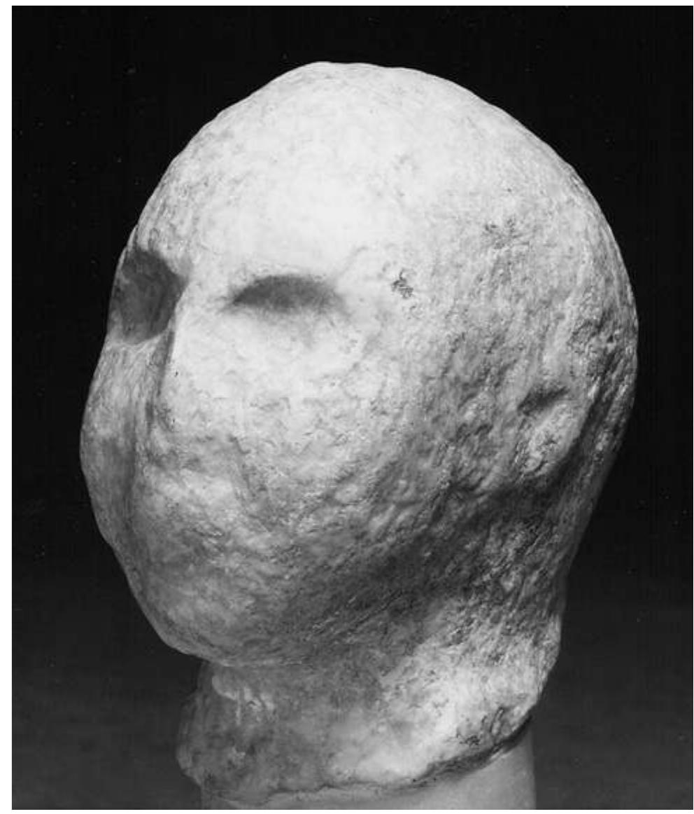 Fig. 36: Early Dynastic head, possibly from Nineveh, height 8 cm (BM 115032). © Trustees of the British Museum 