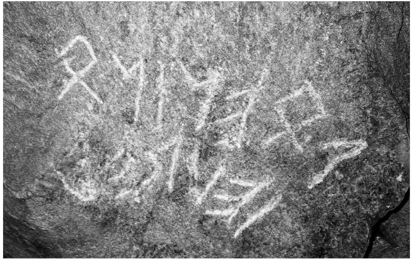 Fig. 11: The so-called Mur d’Hannibal (town of Liddes, Canton of Valais, Switzerland): detail of the inscription. Photograph taken in 2001, four years before its official discov-  ery, (ABERSON, ANDENMATTEN, CASINI, FossaTi, & WACHTER 2021: 329 fig. 4; photo- graph © J.-C. Meilland). 