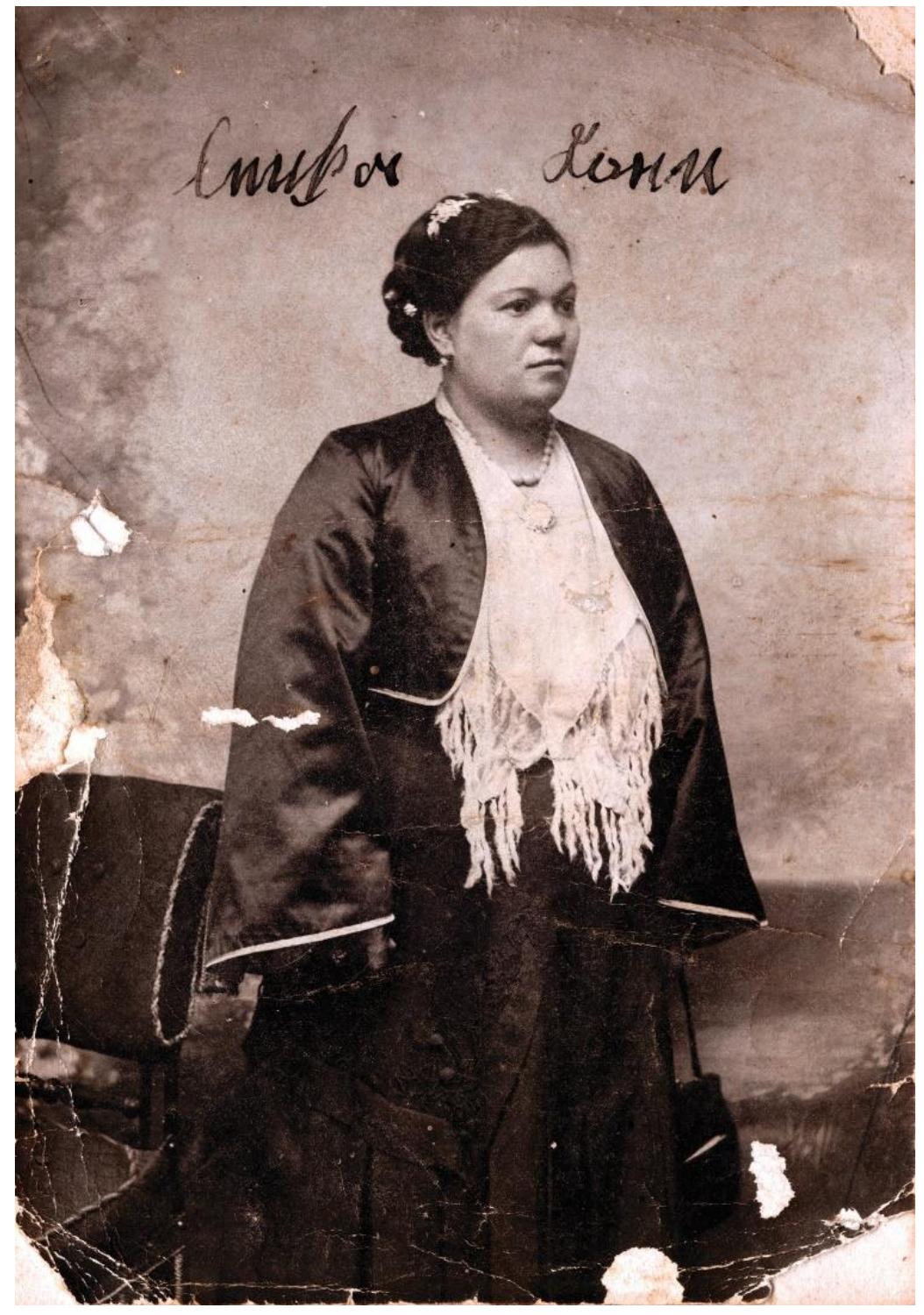 Around the same time, at the beginning of the 20" century, Lenka Koen, daughter of Rahela and sister of Matilda and Jakov, was also photographed in an urban dress (Fig. 7). Unlike her mother, Lenka wears a clothing style that was widespread among the Serbian bourgeoisie and poses in a national costume, which was created by selecting characteristic garments from the dress inventory of the urban population living in formerly Ottoman cities. The new bourgeois elite perceived the constructed costume as authentically national dress and as a sign of visual identity, so it was often used in family portraits, both painted and photographed (Prosié-Dvornié 1981, 12,16; Makuljevié 2006, 43; Maskareli 2019, 26-27). 
