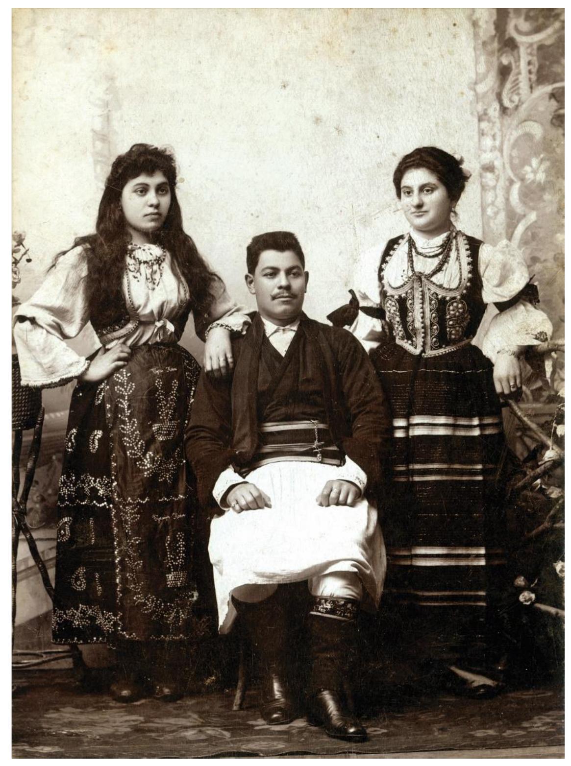 Kalef with her husband Nisim and the other Matilda’s brother, Jakov with their sister Sara and another unidentified woman (Fig. 8).°  If the preserved photographs of the Kalef family members in folk costumes were compared,  it could be seen that both were taken at the same photographic studio of Samuilo-Sima Alkalaj in Belgrade, in an identical interior. Also, Nisim and Jakov Kalef wear exactly the same set of men’s folk costumes, while Matilda Kalef and an unknown woman photographed  with Jakov and Sara Kalef wear the same set of women’s folk costumes. 