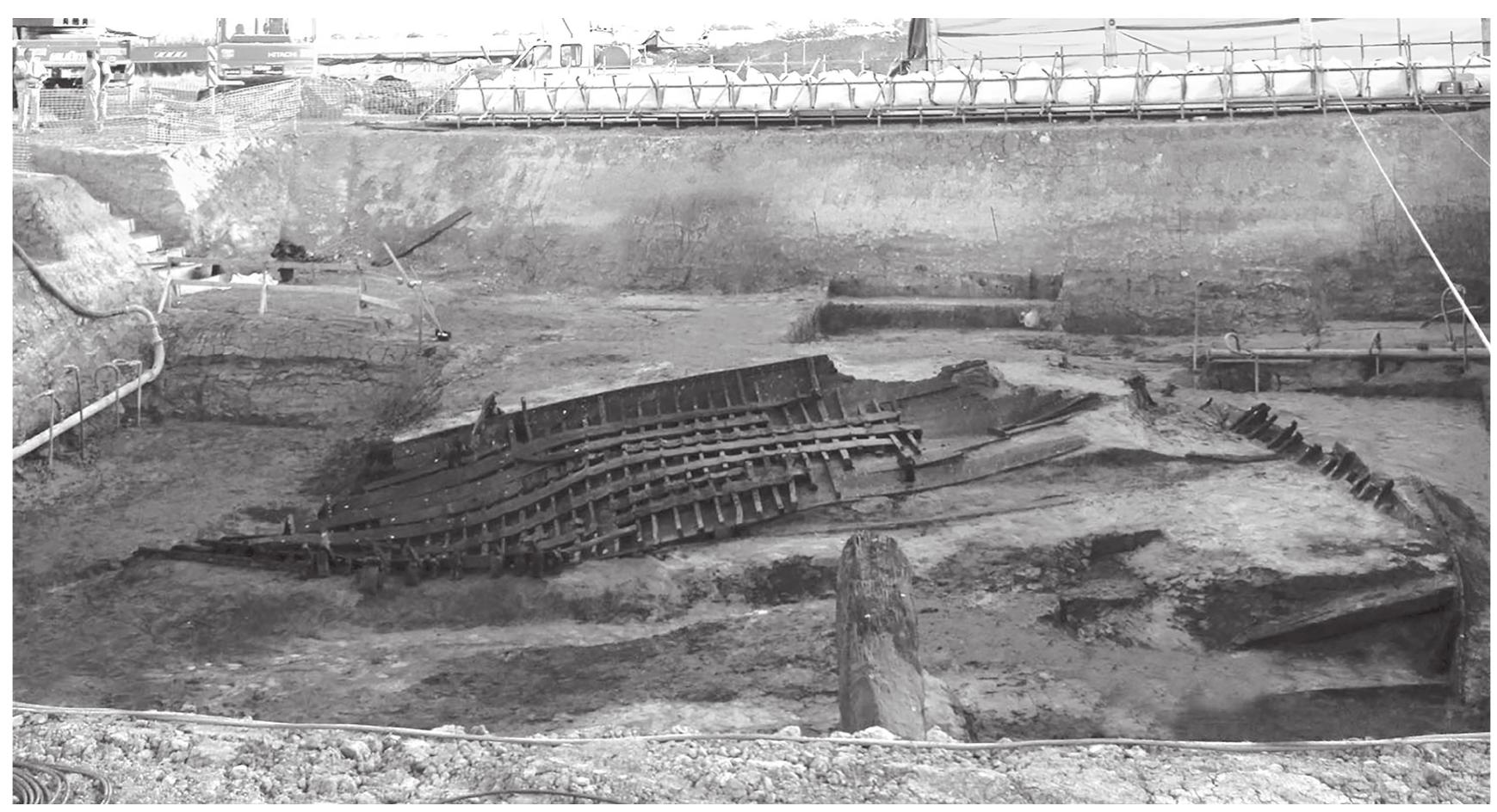 Figure 5.10. View from the south-west of Isola Sacra 1: the distortion of the shipwreck is fully visible. In the foreground can be seen the timber protruding from the southern side of the trench and, on the right, the southern side of Isola Sacra 2. (Photograph: G. Luglio.) 