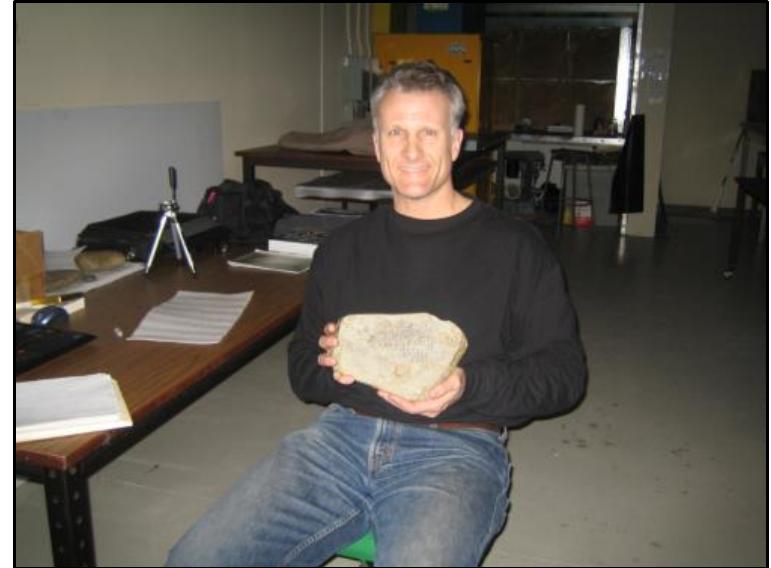 On March 5, 2006, I arrived in Augusta, Maine, but, much to my chagrin, my new black case with the microscope never came through the baggage chute. With only two days to complete my frustrated me [p. 72] that I would miss this chance to examine the rune stones with my equipment. I still had the macro lens on my Canon digital camera; it would have to do the job. Having alrea arrangements with both the Maine State Museum director J. R. Phillips and the archaeologist Bruce Bourque, it didn’t take long to get to work. Bruce and his assistant, Bob Lewis, set me up in a way room with a large table and some good lighting, and then left me alone for the day.  To my pleasant surprise, the half-inch thick playing-card-sized digital camera worked out great. Not only was I able to stabilize the camera with the tripod I’d packed in my luggage, but the macro lens allowed me to take excellent close-up images of all three inscriptions, and the mysterious [p. 73] amulet also reportedly found at Spirit Pond sometime after the rune stones. I was also able to persuade Bruce Bob to collect a tiny piece of the Spirit Pond inscription Stone for a chemical analysis. 