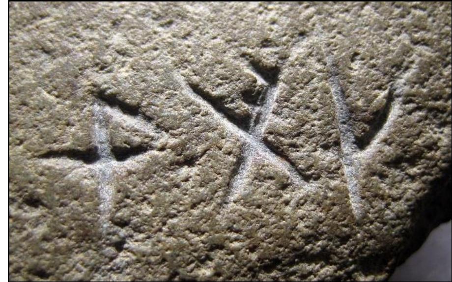 The final inscribed word on the front side of the Map Stone (SP1 is lag. We know that Carver #1 abbreviated words, evident by his spelling of taka as tka. The horizontal branc crossing the / rune (f) was ornamental, the resulting symbolism representing a Christian Cross. The iterative letters for a and k open the door for the following abbreviated stems: la: leeg, lek, leg. Stems with au are also potential candidates.  The author, unsurprisingly, is going to choose words whose definition involves ‘to bathe’ given that the Inscription Stone (SP3) has three internal references to the ‘bath’ of the Virgin Mary — which was the North American Baptistery (Newport Tower). 
