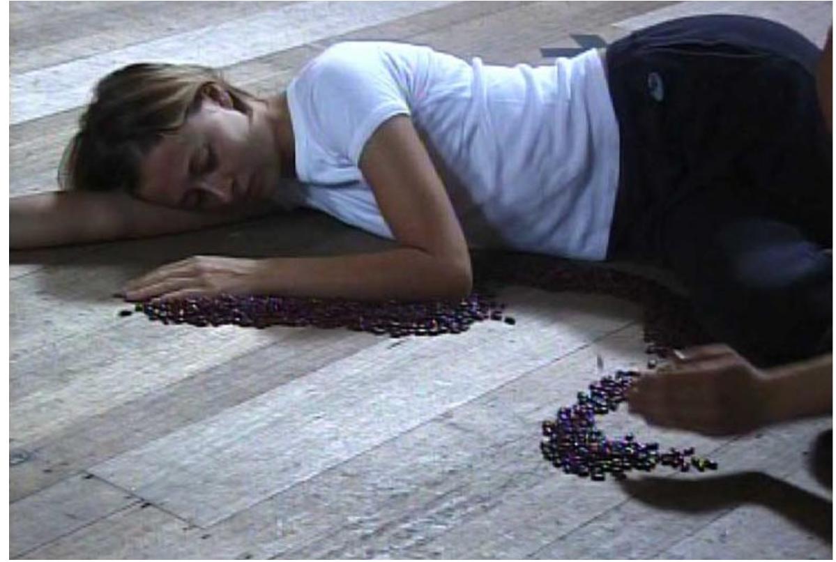 Red kidney beans were used to outline the shape of a prone body.  Puoto: ANNA SMITH. 