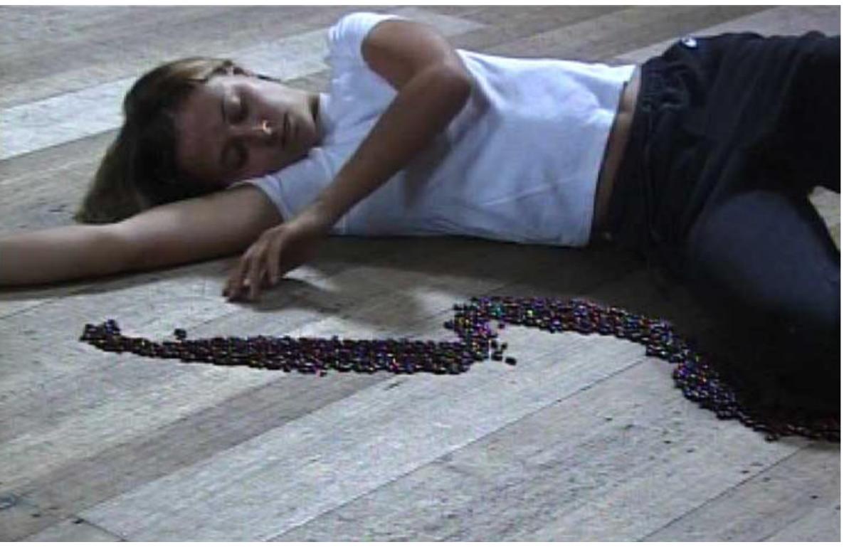 The line of the body left behind suggested traces written in blood. 