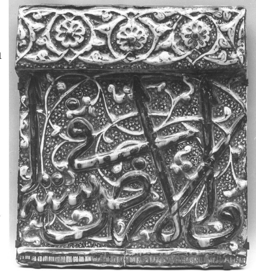A further mihrab came from the Imamzada of ‘Alt b. Ja‘far (Fig. 3) in Qum, a monument built in several phases between 1301 and 1339 and typical of the many mausolea built for highly venerated descendants of the twelve Shi‘i imams across Iran.‘ The mihrab (Fig. 4) is now preserved in the Islamic Museum in Tehran, part of the National Museum of Iran, where it has been since the 1930s, when it was removed from the shrine to protect it from the fate of the many other tiles that were stolen in the nineteenth and early twentieth centuries.*° Like all large-scale mihrabs from Kashan, this example consists of a large rectangle structured with a monumental outer inscription frieze that runs along three sides, from the lower right to the lower left corner. Within this frame, a larger and a smaller niche are nestled within each other, framed in each case by an inscription shaping the top of the niche and columns and capitals in high relief forming the sides (Figs. 5 and 6). Two tiles attributed to the mihrab and belonging to the outer inscription frieze are now at the Metropolitan Museum of Art in New York (Fig. 7)2° A lateral view clearly shows how thick such frieze tiles were; this tile measures 6.7 cm at its thickest (Fig. 8).37 
