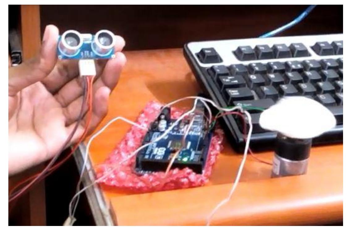 Interfacing of ultrasonic sensor and motor with arduino is