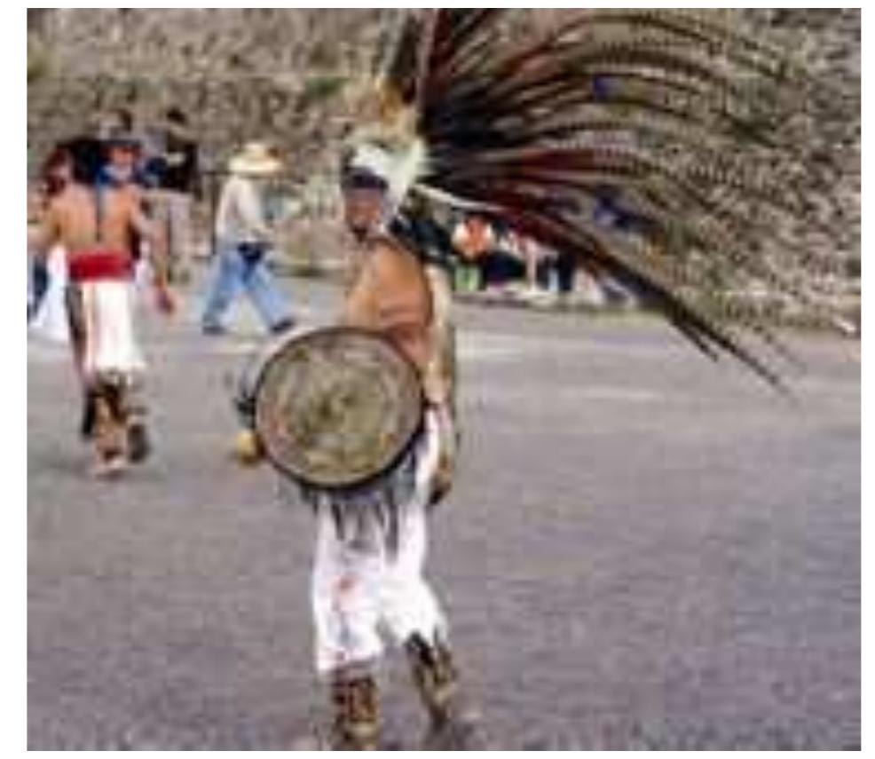 FIGURE 3. “Aztec bailador" or dancer in the plaza of the Pyramid of the Sun, Teotihuacan, Mexico. Photo: Timothy Webmoor.  Through the end of October 2006, interested visitors or contributors could read, watch, and listen to the collected content stored on Yahoo!’s servers through the 