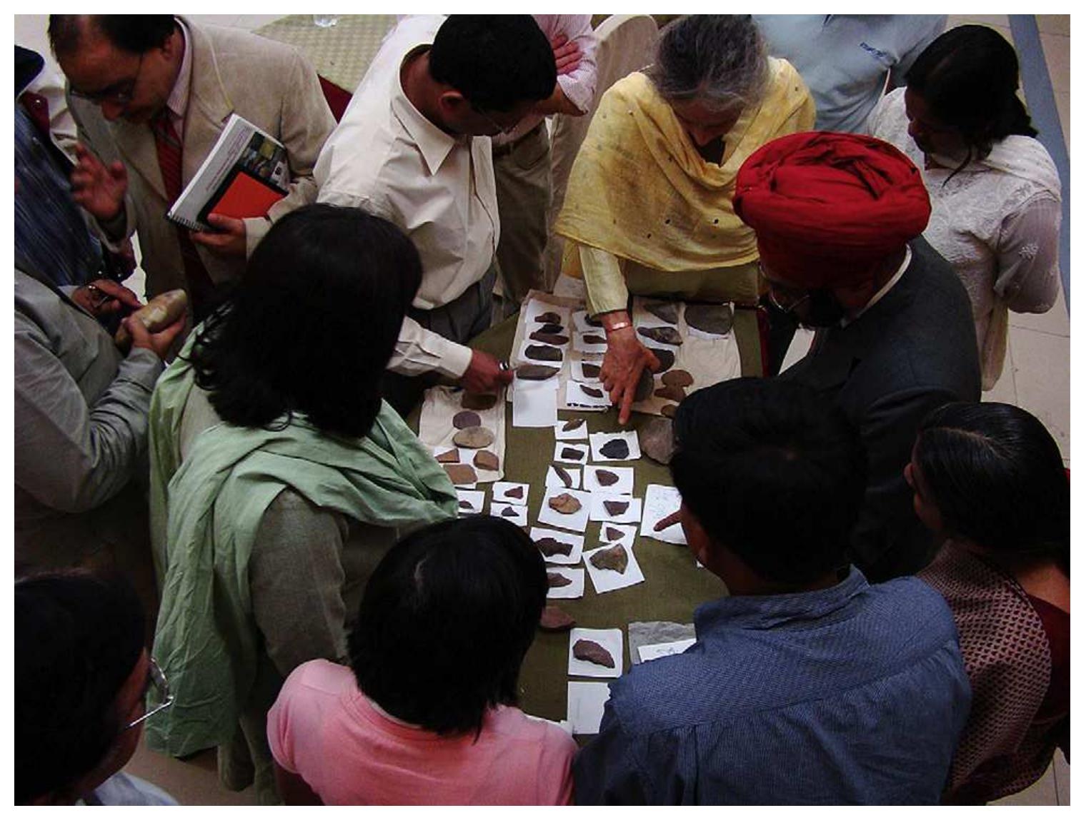 Fig. 1. Conference delegates investigating and discussing Soanian assemblages from the Siwalik Hills. 
