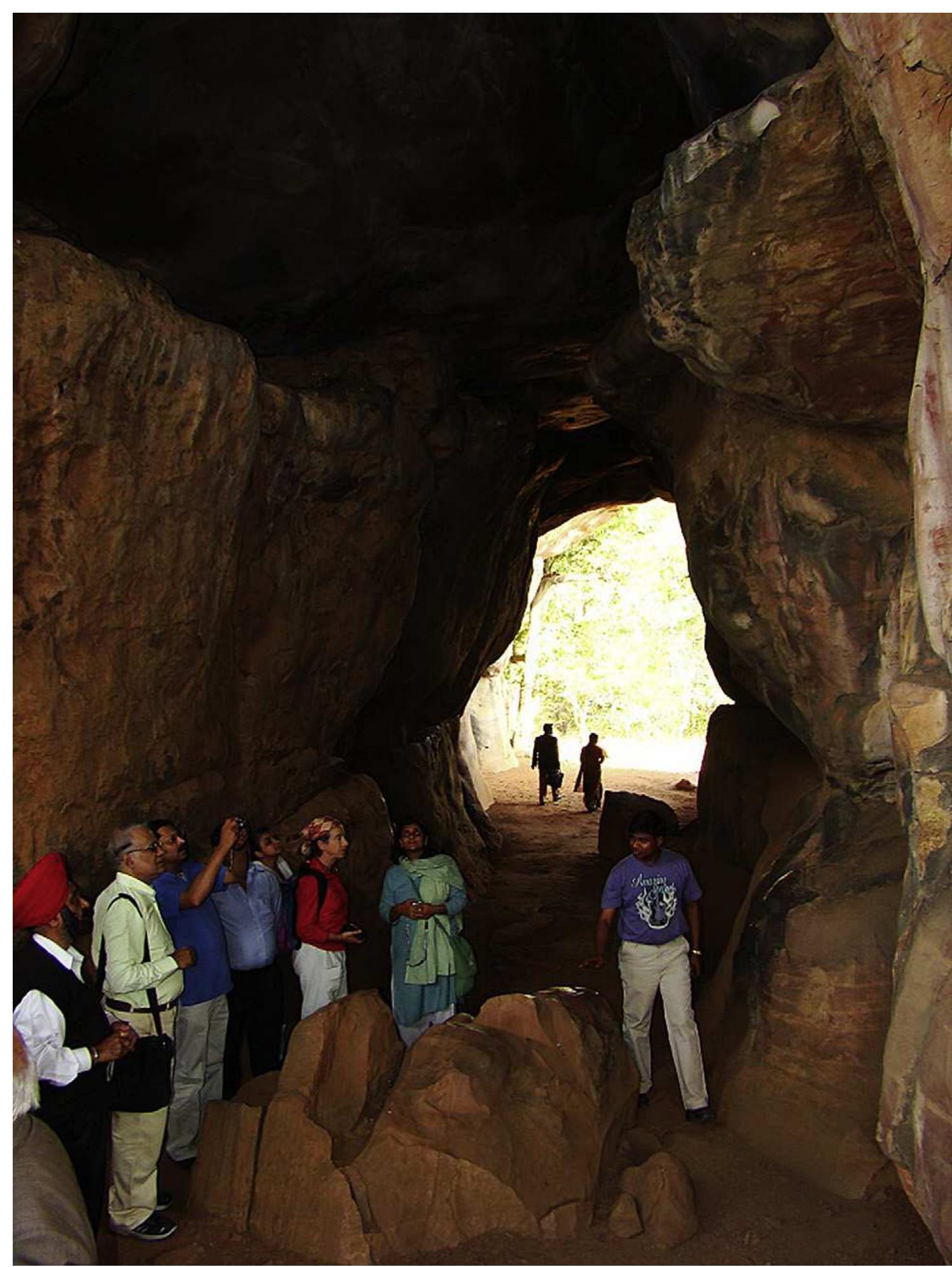 Fig. 4. Conference delegates investigating the rock art at Bhimbetka. 