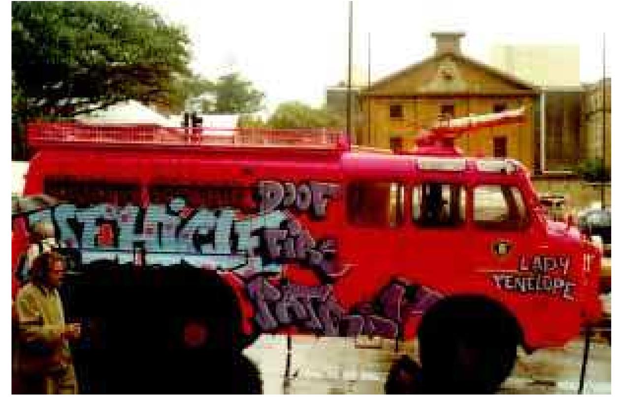 The multicolored Omnibus, an old state transit bus bought from an old depot in Wollongong, came into being at a Graffiti Hall party. With Tony Spanos’ lateral mechanics, it was unleashed on Sydney. Like a slice of Graffiti, it cruised the streets before embarking on its maiden voyage. People used to try to hail it at bus stops — one time it stopped and picked up someone going to Newtown. The Peace Bus, another legendary bus which had belonged to Sydney University, was also refitted with a 3k sound system and was used to protest the insane Jabiluka mine. The old green Oz Experience bus was also painted up with anti nuke messages, broadside speakers in the luggage hatches, and an onboard DJ booth powered by a generator strapped to the roof. This booming system used to set off car alarms, rattle cappuccino cups, enlist much bemused head-scratching and bring hundreds of smiles to faces around town. EARTH REPAIR FirE TRUCK AT TONY SPANOS’ SUPREME COURT CASE PROTEST/VIGI, OCTOBER 99 (PHOTO. PETER STRONG) bring hundreds of smiles to faces around town.