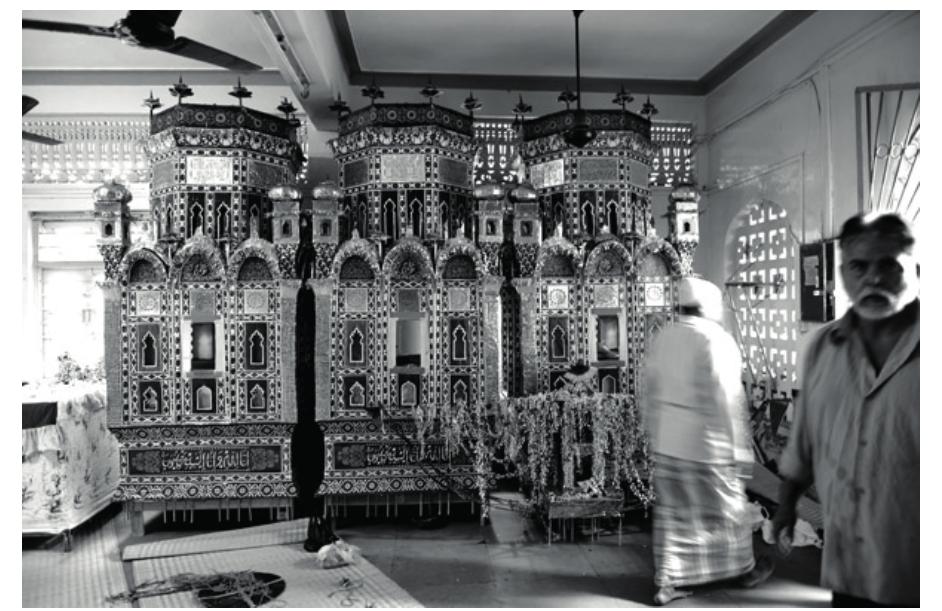 Figure 8: The ta’zyehs in Lotus Colony, Govandi, Mumbai, December 2009.  about 15 years ago. He is currently the imam-i jamat?? of Shi’as in Mumbra. He mentioned that ‘as people are mostly from UP, they are car- rying the ta’zyeh through the procession which is towards Rati Bandar where they immerse the symbolic dome every year’ (interview in December 2009, Mumbra, Mumbai). Razavi also explained that in UP, wherever there is no sea- front, people would carry the ta’zyeh towards a cemetery and bury it in an open field next to the cemetery, often called ‘Karbala’. In fact, that is the action carried out during the Muharram ritual in Lotus Colony in Govandi. Ershad Hussein, who is the trustee of the Ajuman of Lotus Colony (est. 1968), explained that the ta’zyehs are car- ried through procession and buried in Govandi; then some people go to Dongri to participate in the main procession (Interviewed December 2009, Govandi, Mumbai). 