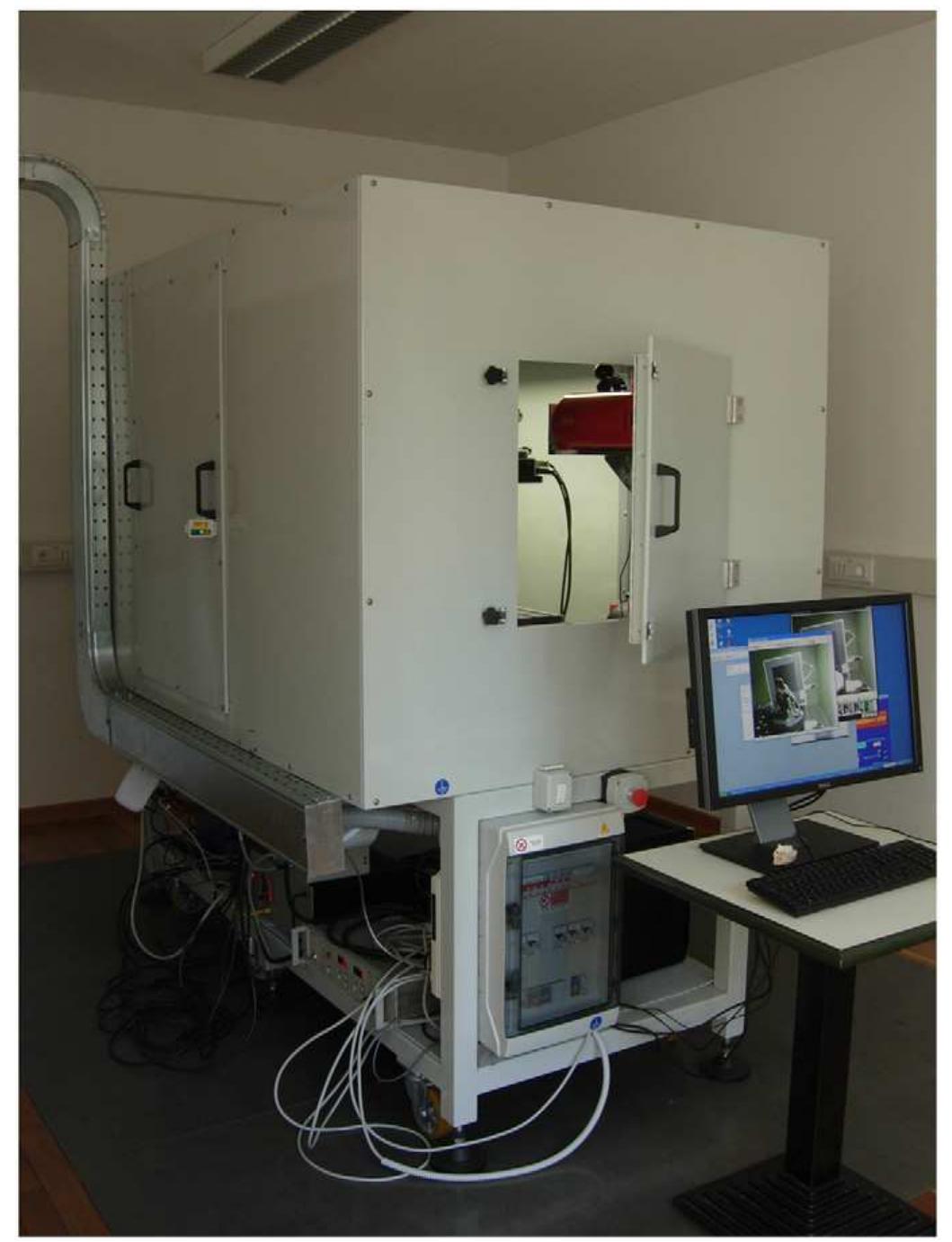 Fig. 2. The ICTP-ELETTRA microCT system (inside the facility and the lead- shielded cabinet used to operate the mCT in the ICTP laboratory). 