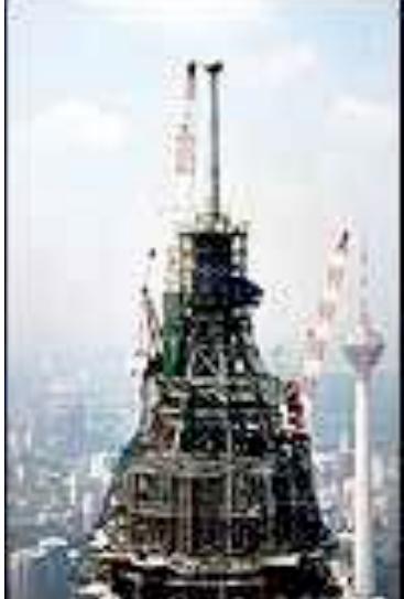 Squeaking past the Chicago Sears Tower by 33 feet, the spires atop the Petronas Towers peak at an impressive 1,483 feet. Yet there's a controversy. The highest occupied floor in the Sears Tower is actually 200 feet higher than the top floor of the Petronas Towers, and its antennae stretch higher still.  Until 1998, the world's tallest skyscraper had always been in the United States. But that year, Malaysia's Petronas Towers laid claim to this distinction. 