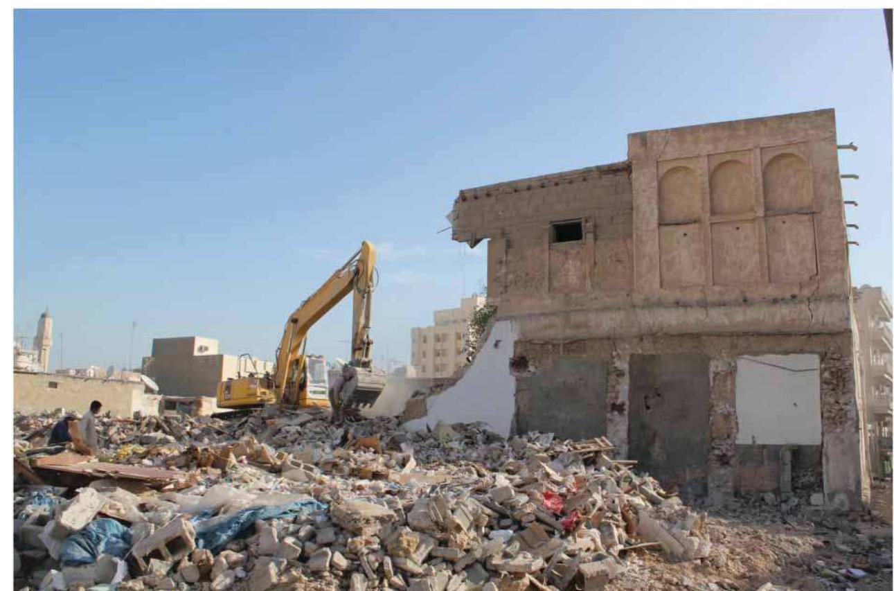 Figure 11. Demolition of an old house in Al Asmakh. most of Al Asmakh’s houses and a few conservation attempts were conducted by the Ministry of Media and Tourism, but these actions were piecemeal and not documented. During 2000-2012 the Department of Building Engineering in the Ministry of Municipal Affairs and Agriculture and the National Council for Culture, Arts and Heritage undertook some restoration work on selected buildings suffering from advanced deterioration (Figure 11).