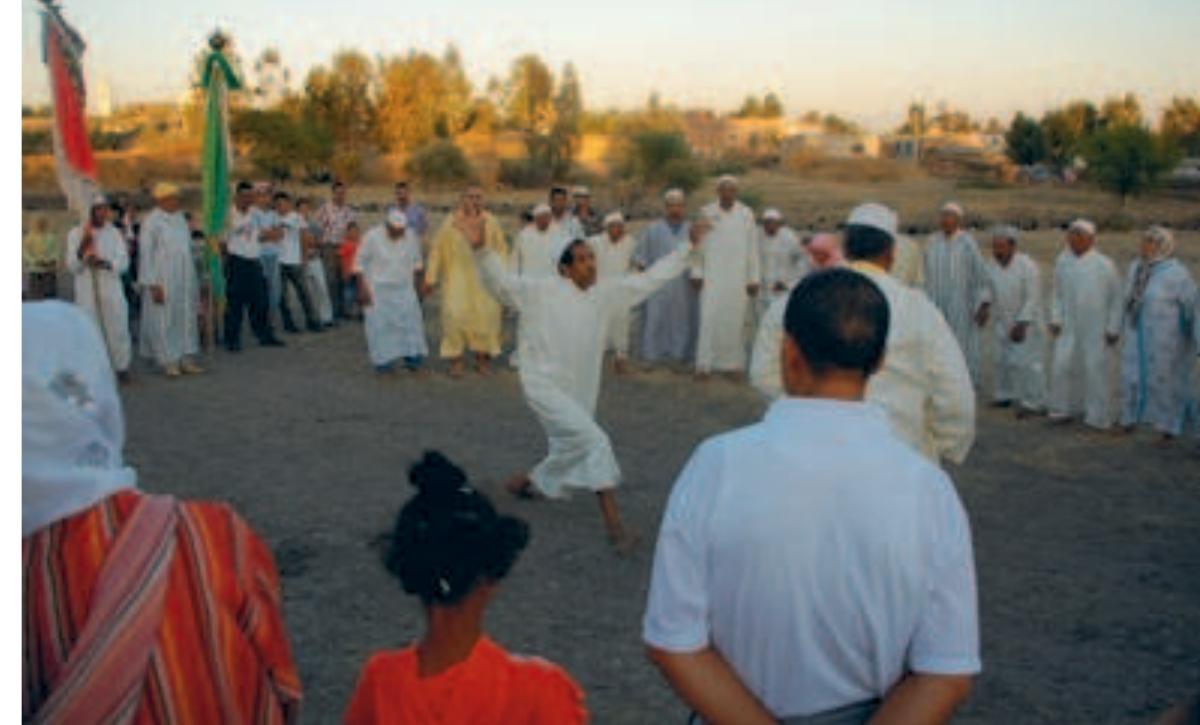 The ritual congregation is animated by an ‘Isawi imitating the stalking moves of the camel-spirit Photo: Martin Zillinger, 2008 